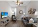 Cozy living room with comfortable seating, a TV, and decorative accents creating a relaxing atmosphere at 8045 Tybee Ct # 8045, University Park, FL 34201