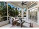 Inviting sunroom with ample light, neutral tones, and comfortable wicker furniture for serene relaxation at 8045 Tybee Ct # 8045, University Park, FL 34201