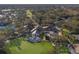 Expansive aerial view of the golf course, clubhouse, and surrounding community, featuring lush landscaping and pristine fairways at 8771 52Nd E Ave, Bradenton, FL 34211