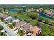 Picture of the community featuring golf course views, ponds, lush landscaping, and lovely residential homes at 8771 52Nd E Ave, Bradenton, FL 34211