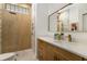 Modern bathroom with a wood-look shower, stylish vanity, and updated fixtures at 8771 52Nd E Ave, Bradenton, FL 34211