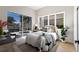 Cozy bedroom with a view of the pool, comfortable bedding, and neutral decor at 8771 52Nd E Ave, Bradenton, FL 34211