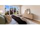 This bedroom features large windows with natural light, and calming decor with a soothing color palette at 8771 52Nd E Ave, Bradenton, FL 34211
