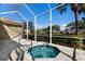 Screened in hot tub overlooking manicured golf course, perfect for relaxation and privacy at 8771 52Nd E Ave, Bradenton, FL 34211