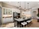 Gourmet kitchen boasting a center island, white cabinetry, and stainless steel appliances at 8771 52Nd E Ave, Bradenton, FL 34211