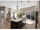 Bright, modern kitchen with a large island, stainless steel appliances, and direct access to the patio at 8771 52Nd E Ave, Bradenton, FL 34211
