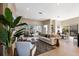 Spacious living room with neutral decor, stylish furniture, and sliding doors to outdoor area at 8771 52Nd E Ave, Bradenton, FL 34211
