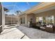 The screened outdoor living space features a spa, outdoor kitchen, and comfortable seating area at 8771 52Nd E Ave, Bradenton, FL 34211