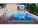 A backyard pool with waterfall feature and stylish patio furniture set at 8771 52Nd E Ave, Bradenton, FL 34211