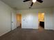 Carpeted bedroom with ensuite bathroom and closet at 8864 Milestone Dr, Sarasota, FL 34238