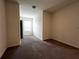 Bedroom with carpet flooring and a view of an open door to another room at 8864 Milestone Dr, Sarasota, FL 34238