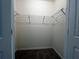 Walk-in closet with wire shelving and carpet at 8864 Milestone Dr, Sarasota, FL 34238