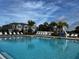 Enjoy the Florida lifestyle at the community pool with lounge chairs and sun at 8864 Milestone Dr, Sarasota, FL 34238