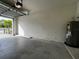 This garage offers ample space for parking with a water heater on the side at 8864 Milestone Dr, Sarasota, FL 34238