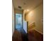 This hallway features carpeted floors and neutral walls at 8864 Milestone Dr, Sarasota, FL 34238