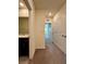 This hallway features carpeted floors and neutral walls at 8864 Milestone Dr, Sarasota, FL 34238