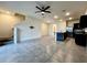 Open-concept living space with a modern kitchen and staircase at 8864 Milestone Dr, Sarasota, FL 34238
