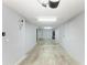 Spacious, unfinished basement provides a blank canvas for customization, featuring ample lighting, and concrete flooring at 8943 White Sage Loop, Lakewood Ranch, FL 34202