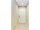 Bright entryway with neutral walls, tiled flooring, a white front door, and recessed lighting at 8943 White Sage Loop, Lakewood Ranch, FL 34202