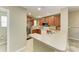 Modern kitchen with stainless steel appliances, spacious countertops, and updated cabinetry at 8943 White Sage Loop, Lakewood Ranch, FL 34202