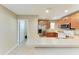 Spacious kitchen with stainless steel appliances and ample countertop space for meal preparation and entertaining at 8943 White Sage Loop, Lakewood Ranch, FL 34202