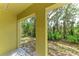 Secluded patio space with views of the surrounding greenery, perfect for private relaxation and peaceful enjoyment at 8943 White Sage Loop, Lakewood Ranch, FL 34202