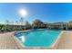 Sparkling pool, featuring well-maintained brick pool deck and plenty of lounge seating, perfect for relaxing in the sun at 8943 White Sage Loop, Lakewood Ranch, FL 34202