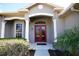 Inviting front entryway with elegant double doors, decorative columns, and lush landscaping for curb appeal at 9112 63Rd E Ct, Parrish, FL 34219