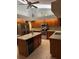 Bright kitchen with tile floor, an island, stainless steel appliances, granite countertops, and lots of storage space at 9112 63Rd E Ct, Parrish, FL 34219