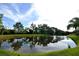 Picturesque pond surrounded by lush landscaping offers a tranquil view at 9112 63Rd E Ct, Parrish, FL 34219
