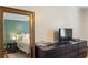 View into bedroom featuring stylish decor, neutral paint, and natural light from two windows at 3269 Beneva Rd # 102, Sarasota, FL 34232