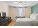 Serene bedroom with comfortable bed, dark dresser, and bright windows; perfect for relaxation at 3269 Beneva Rd # 102, Sarasota, FL 34232