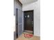 Welcome home at the front door with a cozy watermelon door mat at 3269 Beneva Rd # 102, Sarasota, FL 34232