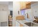 Modern kitchen featuring granite countertops and views to the living room at 3269 Beneva Rd # 102, Sarasota, FL 34232