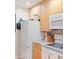 Efficient kitchen space featuring modern appliances and ample storage cabinets, ready for cooking at 3269 Beneva Rd # 102, Sarasota, FL 34232