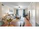 Open-concept living room with views to the outdoor screened patio at 3269 Beneva Rd # 102, Sarasota, FL 34232