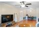 Cozy living room featuring tile flooring, a ceiling fan, and an adjacent dining area at 3269 Beneva Rd # 102, Sarasota, FL 34232