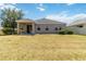 Expansive backyard showcasing a well-maintained lawn, offering a private oasis for outdoor enjoyment at 10860 79Th E St, Parrish, FL 34219