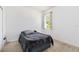 Cozy bedroom with soft carpet, natural light from the window, and neutral tones at 10860 79Th E St, Parrish, FL 34219