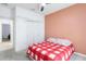 Bedroom featuring modern ceiling fan and a view into the hallway and closet at 10860 79Th E St, Parrish, FL 34219
