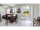 Bright dining area with patio access and modern decor at 10860 79Th E St, Parrish, FL 34219