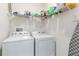 Laundry room featuring a washer, dryer, and wire shelving at 10860 79Th E St, Parrish, FL 34219