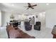 Open concept living area featuring tile floors, modern lighting, and a combined living and dining space at 10860 79Th E St, Parrish, FL 34219