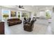 Spacious living room with tile flooring, ample natural light, and comfortable seating at 10860 79Th E St, Parrish, FL 34219