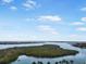 Expansive aerial view showcasing a coastal neighborhood surrounded by serene waterways at 114 Fillmore Dr, Sarasota, FL 34236