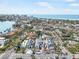 Aerial view of coastal community featuring modern homes, palm trees and the ocean in the background at 114 Fillmore Dr, Sarasota, FL 34236