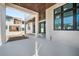 Covered balcony with white columns that offers expansive views of the surrounding neighborhood at 114 Fillmore Dr, Sarasota, FL 34236
