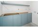 Bathroom featuring a blue vanity against white walls at 114 Fillmore Dr, Sarasota, FL 34236