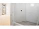 Bathroom featuring a modern shower stall with marble style tiles and glass door at 114 Fillmore Dr, Sarasota, FL 34236