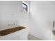 Bathroom featuring a white vanity against white walls at 114 Fillmore Dr, Sarasota, FL 34236